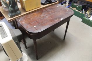 A 19th Century mahogany fold over card table (AF)