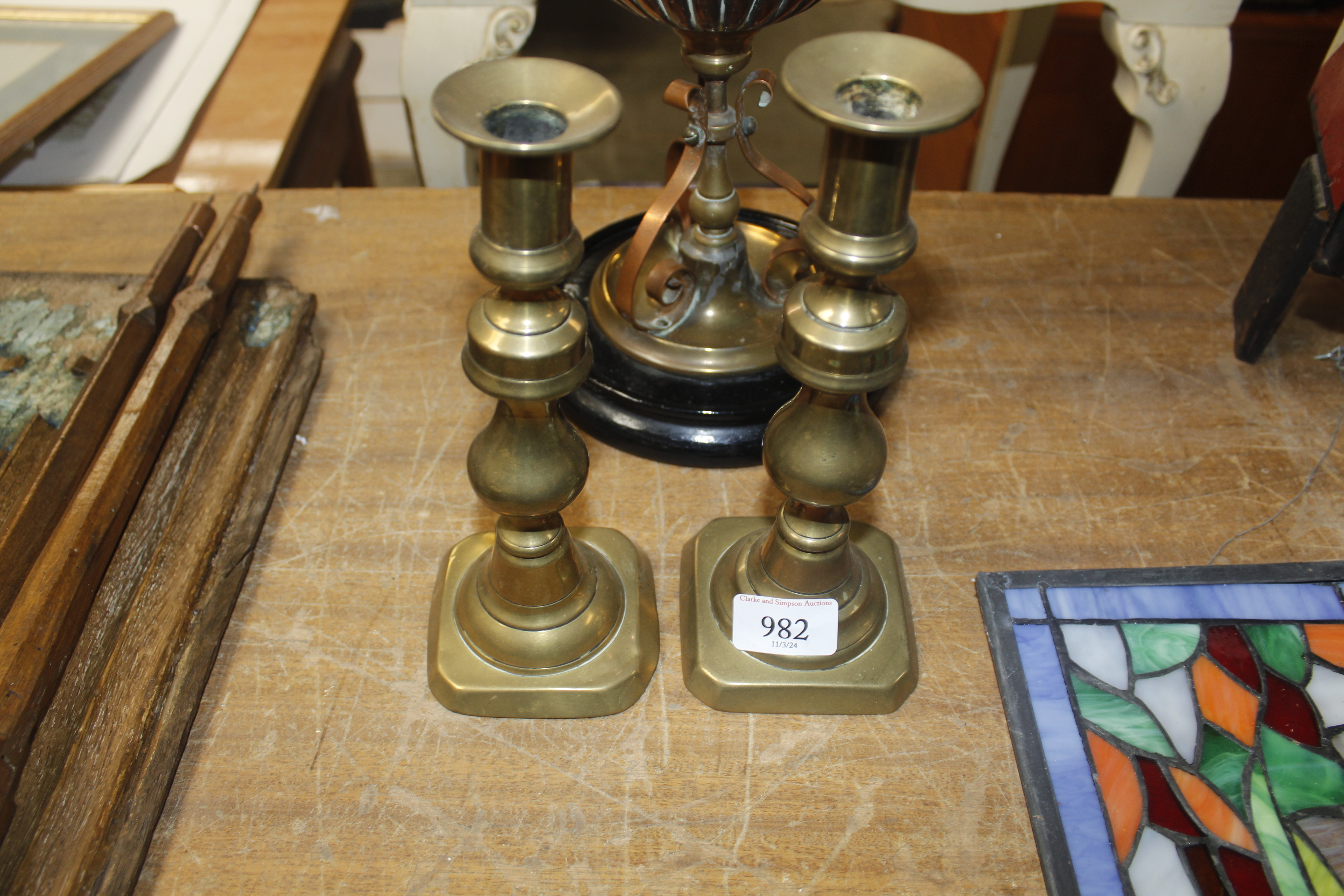 A pair of brass candlesticks