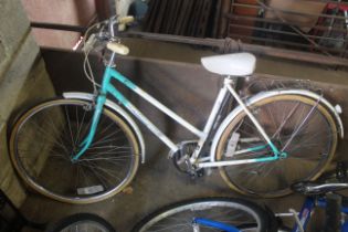 A ladies Universal  Riviera Sports bicycle with front and rear mud guards, rear paneer rack and
