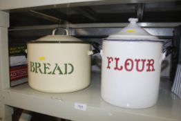 An enamel flour bin and an enamel bread bin