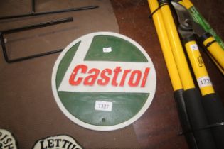 A painted circular cast iron sign for Castrol (192