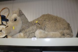 A soft toy camel