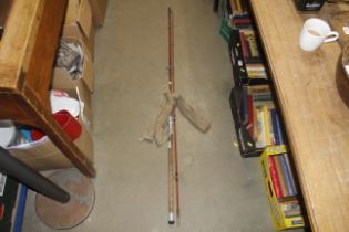 A vintage cane two piece fishing rod by J.S. Sharp
