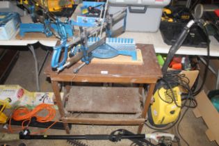 A Mitre saw mounted to wooden work bench