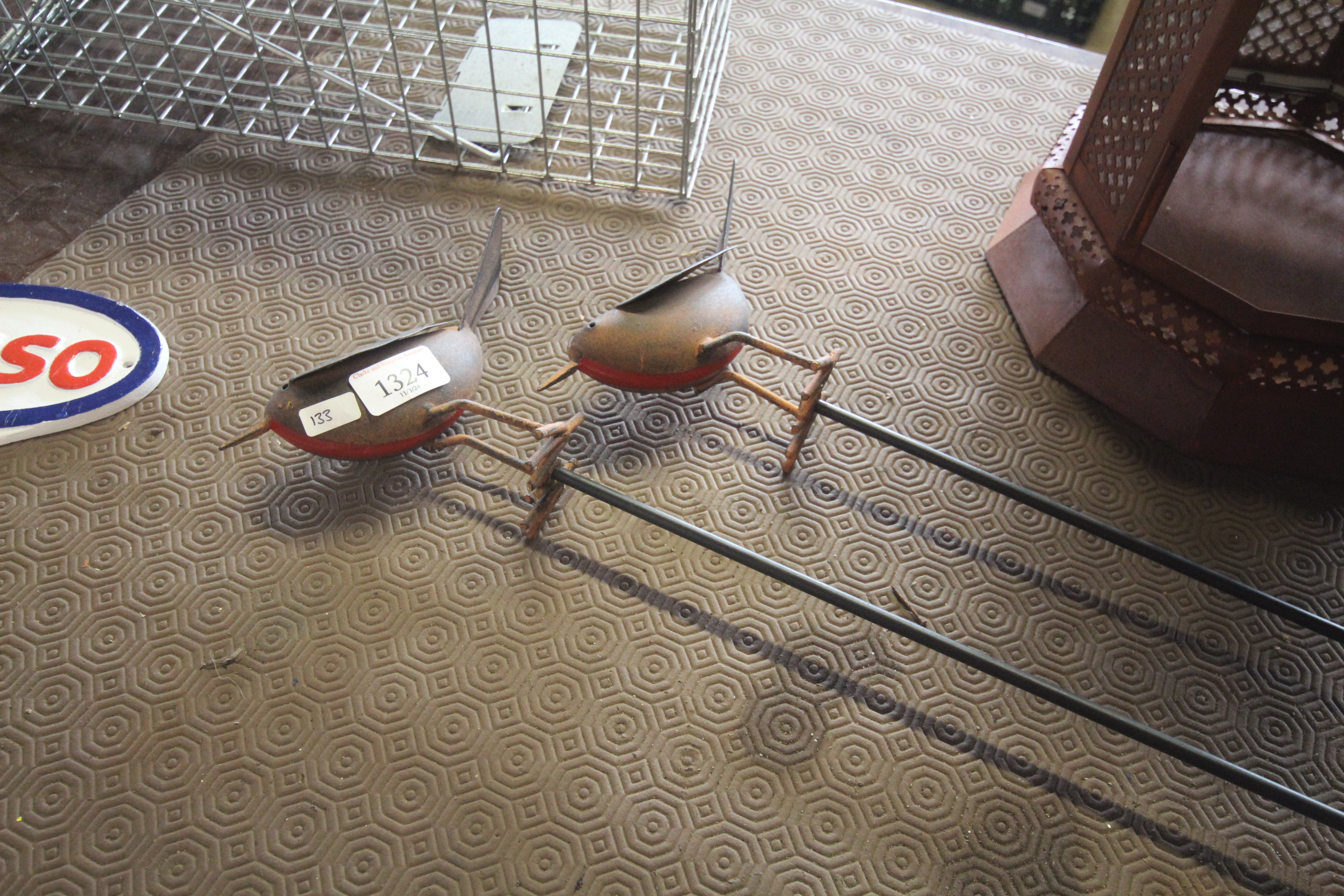 Two metal robin figures mounted to metal stakes (1