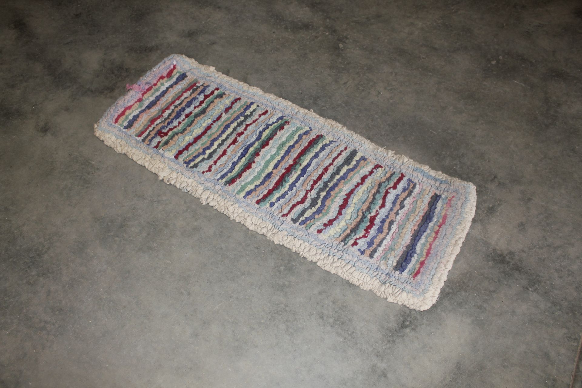 A rag rug approx. 3'10" x 1'7"