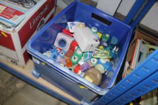 A box of various cutting tools, stationery stamps