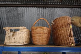 Two wicker baskets and a wicker pet basket