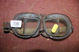 A pair of vintage motorcycle goggles