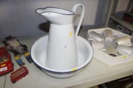 A vintage enamel jug and bowl