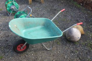 A plastic garden wheelbarrow