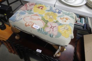 A tapestry upholstered footstool