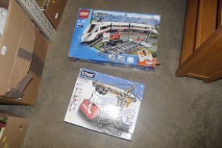 A boxed Lego city set and K'Nex building set