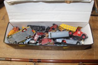 A tin of diecast vehicles to include Dinky example