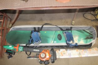 A Soloman Driver D-165 snowboard with bindings and