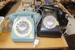 A rotary dial telephone and one other