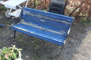 A wooden and metal two seater garden bench (painte