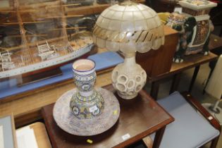 A pottery table lamp and shade, a pottery vase and