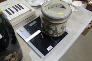 A set of scales and a Studio Pottery jar and cover