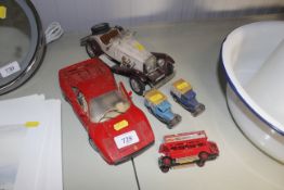 A Burago Ferrari model and four other toy vehicles