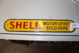 A reproduction cast iron Shell sign