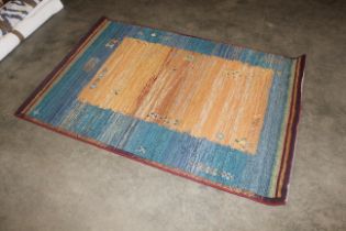 A Gabbeh brightly coloured rug approx. 5'10" x 4'