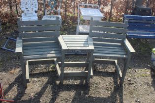 A wooden side-by-side bench with integrated centra