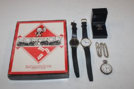 A boxed game of Monopoly; two wrist watches; a sil