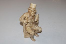 A porcelain figure in the form of a seated gentlem