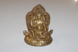 An old Oriental gilded and bronze figure, possibly C