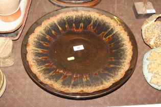 A large Poole Studio pottery charger