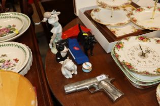 A gun shaped ash tray; a Lladro polar bear; a Nao