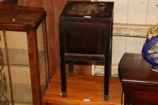 A 20th Century oak sewing box with lifting lid and