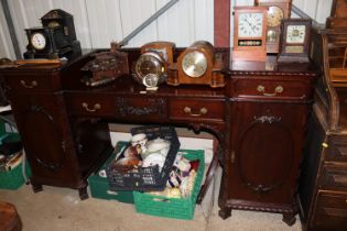 An early 20th Century carved mahogany pedestal sid