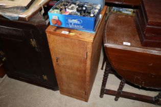 A mid-20th Century golden oak bedside cupboard fit