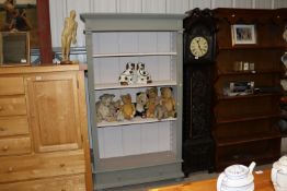 A painted open fronted bookcase fitted single draw