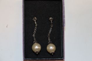 A pair of 925 silver and pearl ear-rings