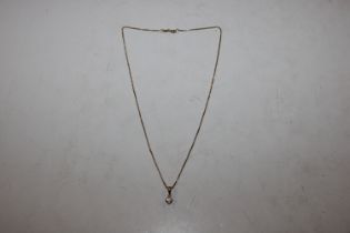 An 18ct gold mounted diamond pendant, approx. ¼ ca