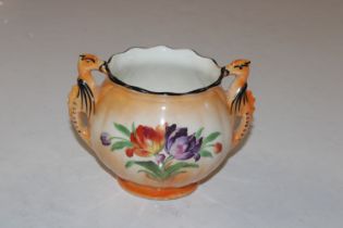 A Continental porcelain floral decorated twin hand