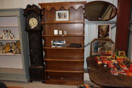 An oak graduated open fronted bookcase