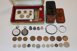 A box containing a tin of various coinage, silver