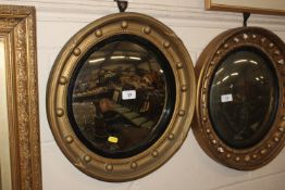 A gilt framed convex wall mirror