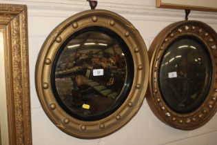 A gilt framed convex wall mirror