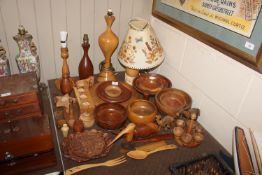 A collection of various carved wooden bowls, table