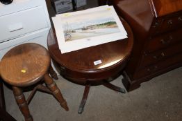 A small mahogany drum shaped occasional table