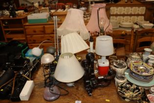 A collection of various table lamps, wall lights e