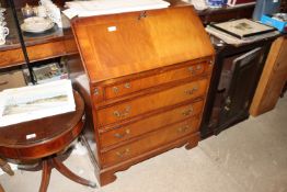 A mahogany reproduction bureau fitted four drawers