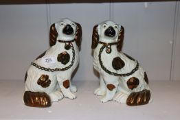 A pair of Staffordshire spaniel ornaments