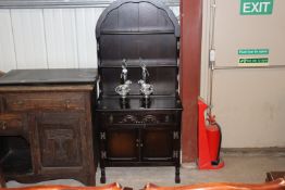 An oak dresser with arched top