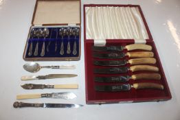 A cased set of six horn handled knives; a cased se